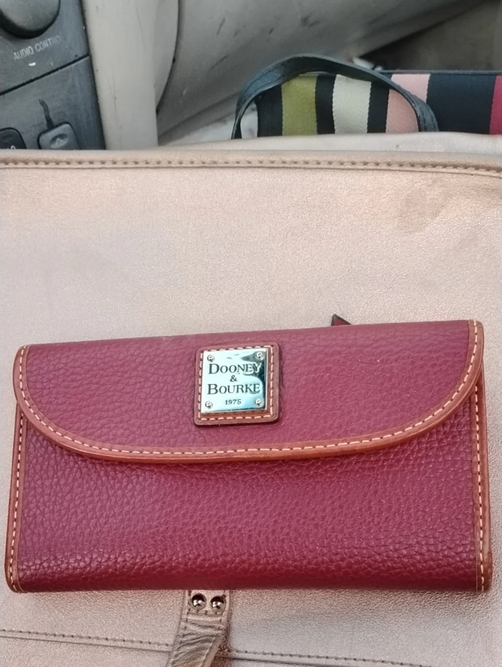 Dooney & Bourke Pinkish Red Pebbled Leather Flap Wallet